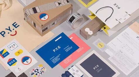 P.Y.E brand identity with stationery, business cards and packaging