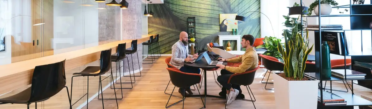 Logo Makers Pro team working in a bright open-plan office